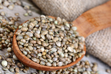 Hemp seeds in a spoon on table