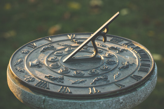 Sundial during sunset, time concept