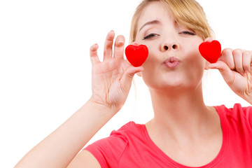 Funny woman holds red hearts love symbol