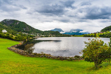 Landscape with lake and Village Solavagen.The county of More og Romsdal. Norway