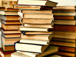 pile of old books in hardcover