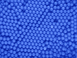 Dragee balls background - dark blue