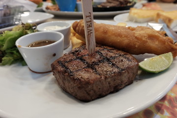 grilled beef steakon white plate