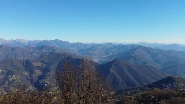 Great landscape with fantastic blue sky on the Orobie Alps and Padana plain a dry winter season without snow. Panorama from Linzone Mountain, Bergamo, Italy. 