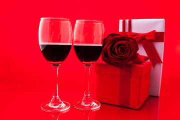 St Valentine's setting with present and red wine