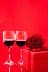 St Valentine's setting with present and red wine