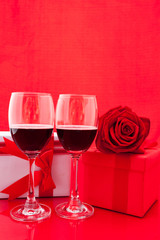 St Valentine's setting with present and red wine