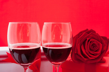 St Valentine's setting with present and red wine