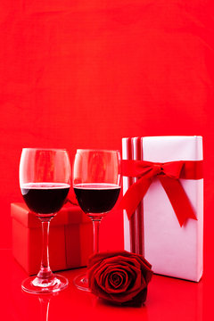 St Valentine's setting with present and red wine