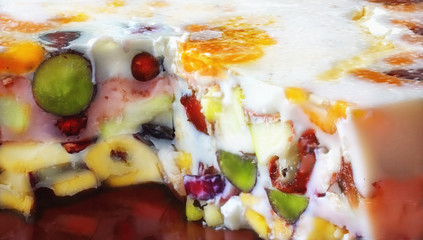 Piece of jelly fruit cake with milk