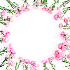 Fototapeta na wymiar Wreath frame made of pink wildflowers, green leaves, branches on white background. Flat lay, top view. Valentine's background