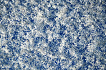the sparkling white snow on the blue