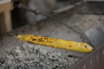 Flatbread with cheese baked on a skewer.