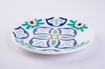 plate or flowers on plate painted by hand on background.