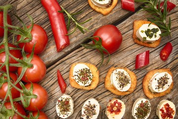 crunchy baguette slices with cream cheese and herbs