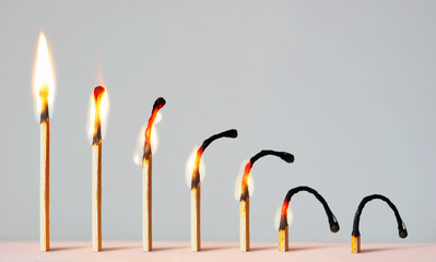 Concept of different phases in human life. Abstract image with burning matches