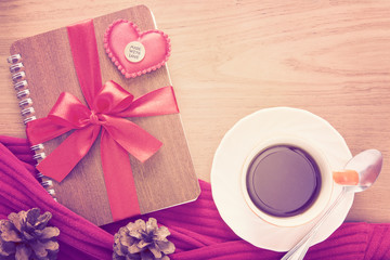 notebook wrapped with red ribbon, red felt hearts with Made With