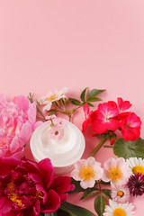 cosmetic creams with pink flowers