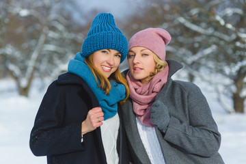 Winter portrait of fashion female friends. Affection and friendship forever Concept