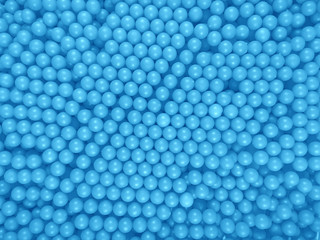 Dragee balls background - light blue