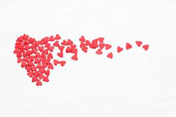 lots of little red hearts flying on white background. romantic love background for Valentine's day, birthday, holiday, party, wedding