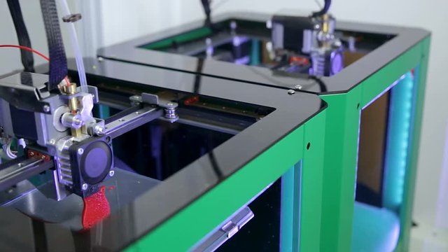 Several 3D printers working printing plastic model with Plastic Wire Filament. HD.