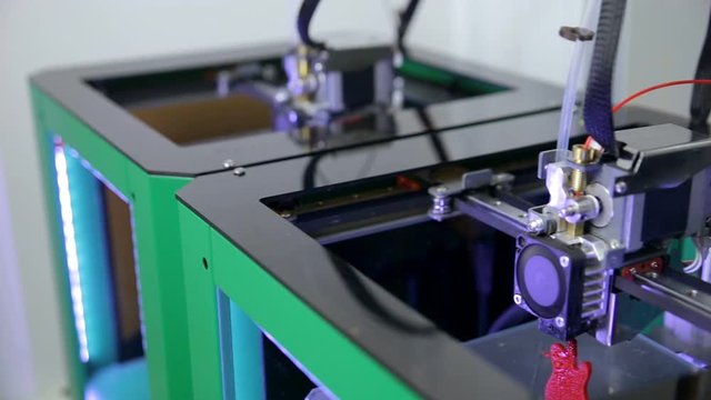 Several 3D printers working printing plastic model with Plastic Wire Filament. HD.