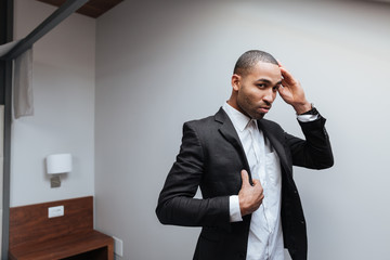 African man preparing in hotel