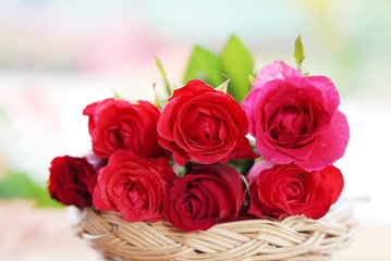 closeup of a bouquet of red roses in a wicker basket for Valentine's Day