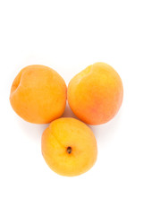 Whole ripe apricots isolated on a white background