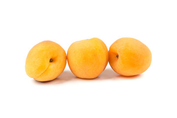 Whole ripe apricots isolated on a white background