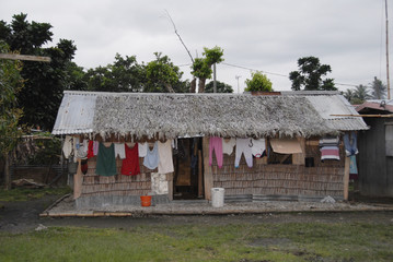 Thatched cottages in Vanuatu with washing on the line