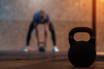 Kettlebell on the background of male athlete