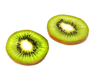 Ripe kiwi slices isolated on a white background