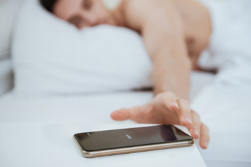 Cropped image of Man lying on bed