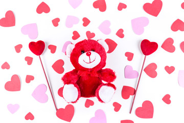 Valentine pink and red heart shapes and bear isolated on a white background