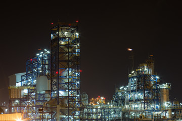 Oil refinery industrial plant at night