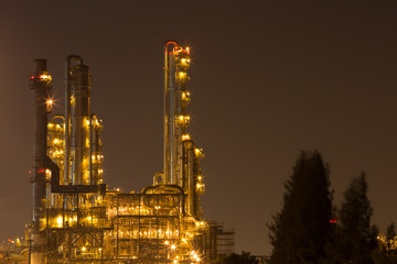 Oil refinery industrial plant at night