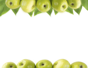 Horizontal seamless background with green apples and leaves. Fresh apples on a white background. Apples at border of image with copy space for text.