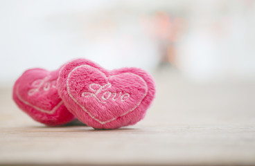 Naklejka na ściany i meble Stock Photo:.Valentines day and red mini heart-shape pillow on o