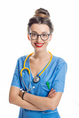 Portrait of a young female doctor in uniform with stethoscope isolated on the white background