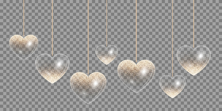 Hearts with sparkling golden reflections on a transparent background for wedding design
