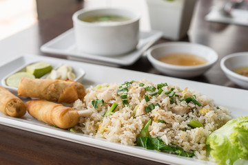 Fried rice with salted fish and fried spring rolls.