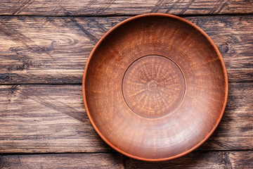 Fototapeta na wymiar bowl on a wooden background