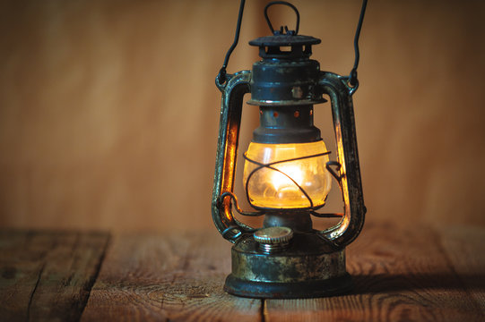 vintage kerosene oil lantern lamp burning with a soft glow light
