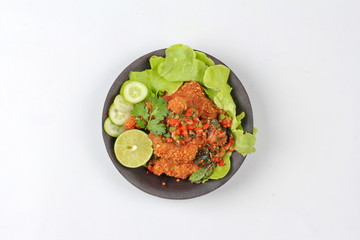 Spicy sour fried chicken salad call Yum Kai Zap - Thai.