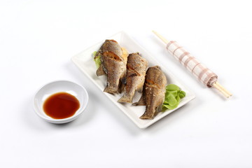 Deep fried small snapper with bean sauce.
