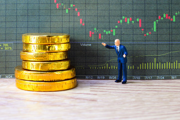 A little trader is taking profit from his stock. trading investment concept.