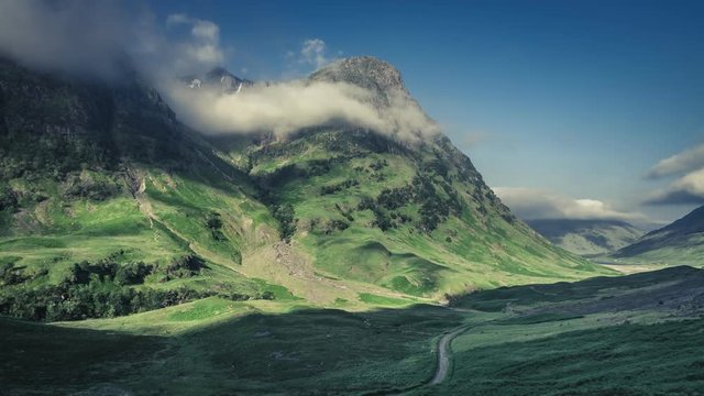 Beautiful dawn over the green mountains of Glencoe in Scotland, 4k, timelapse