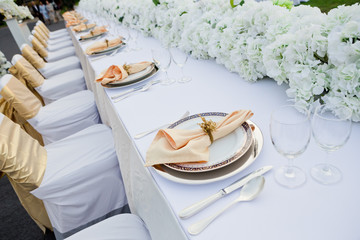 gorgeous wedding chair and table setting for fine dining at outd